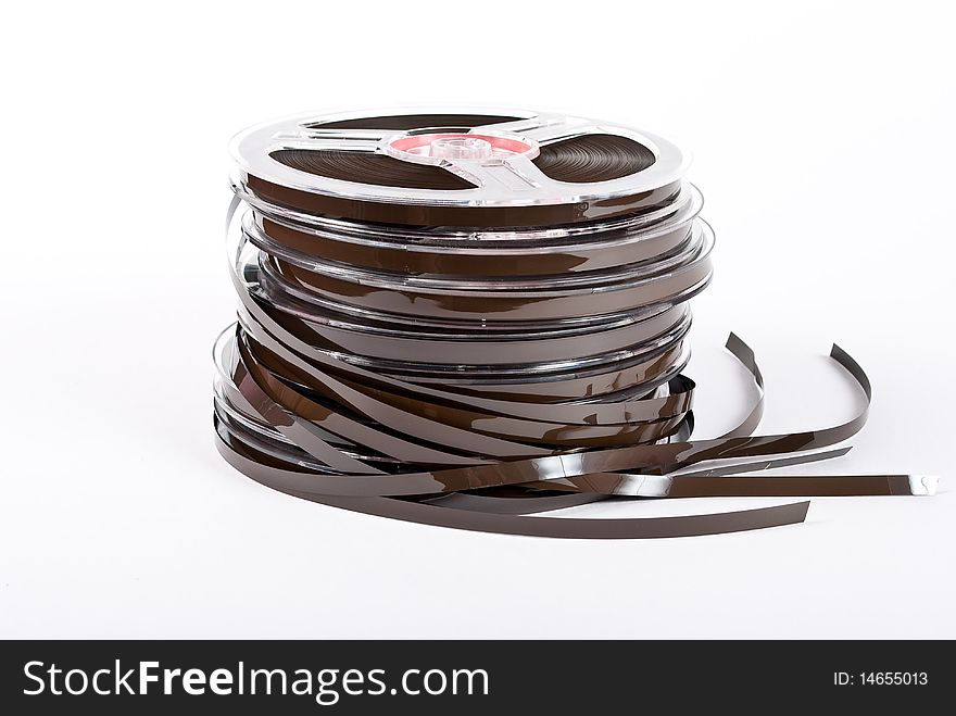 Stack of audio reels tapes on white