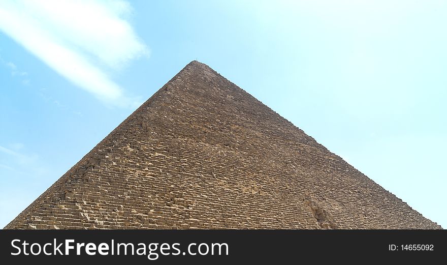 Pyramid in Egypt against the blue sky