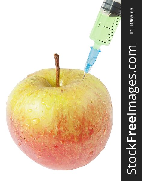 Apple and syringe. genetic modification food