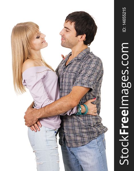 Romantic young couple in casual clothing, white background. Romantic young couple in casual clothing, white background