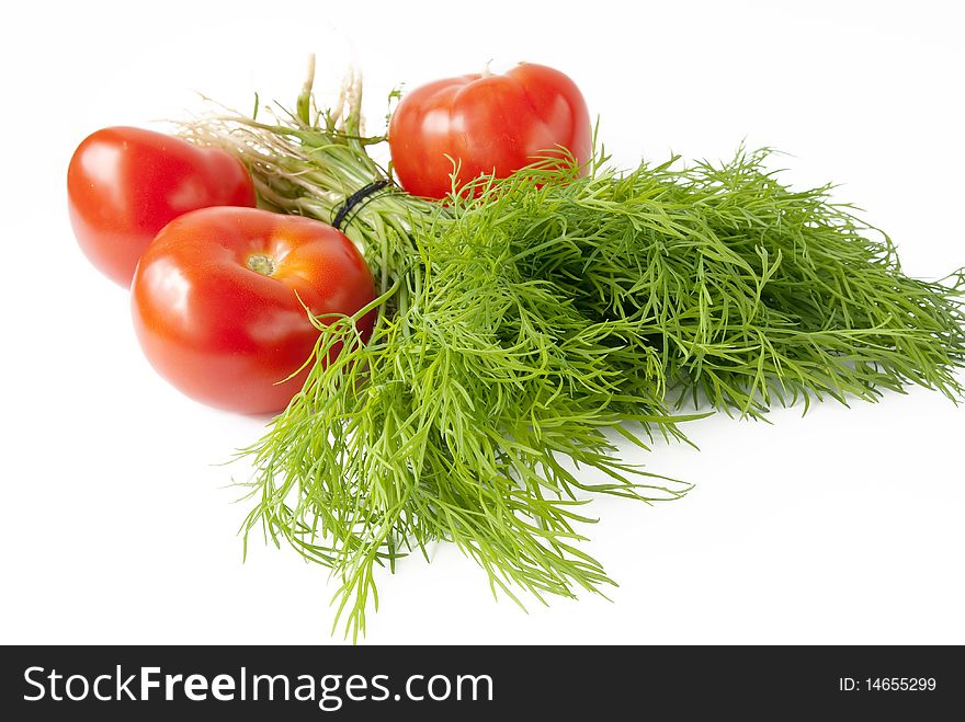 Dill with red tomato over white background