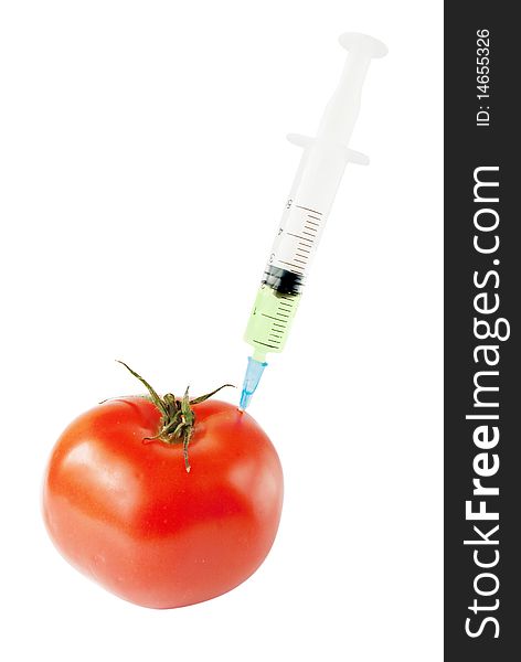 Genetic modification food concept. Tomato with syringe
