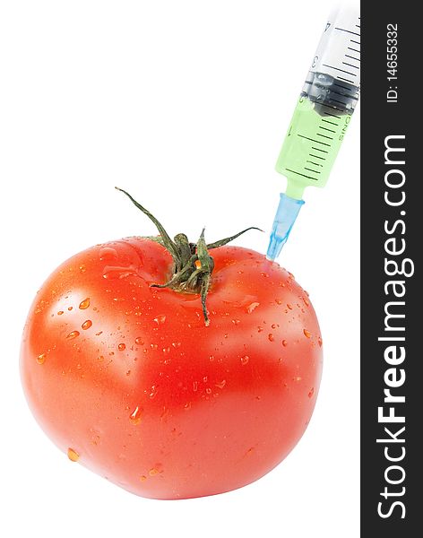Tomato with syringe. genetic modification food concept
