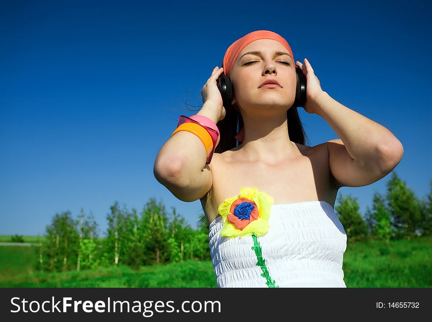 Girl in kerchief with headphones. Girl in kerchief with headphones