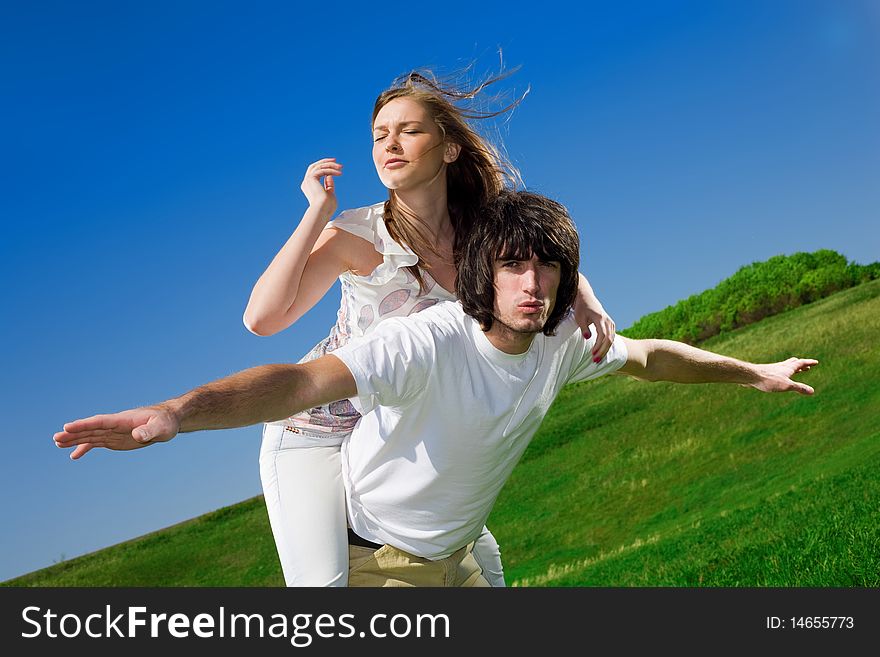 Long-haired girl and boy in white t-shirt