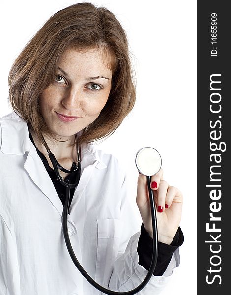 Young nurse with stethoscope in hand on white background