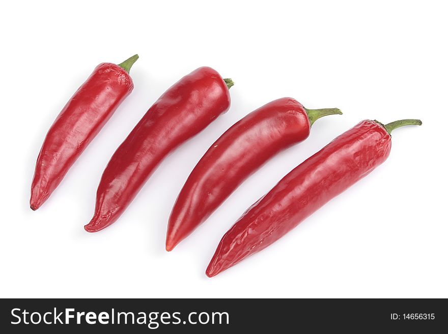 Sweet red chilli peppers over white. Sweet red chilli peppers over white
