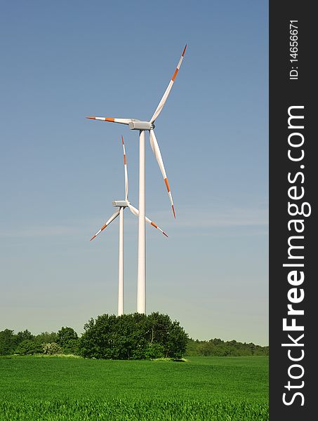 Wind turbine on blue sky background. Wind turbine on blue sky background