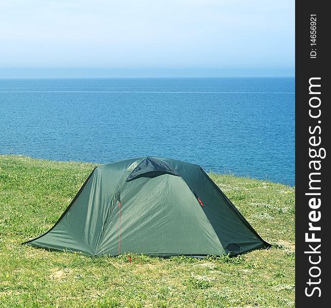 Tourist tent on seashore in the sunshine day