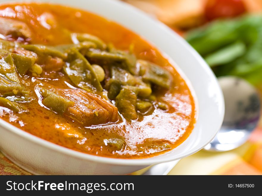 Fresh cooked stew with green beans and roast ham