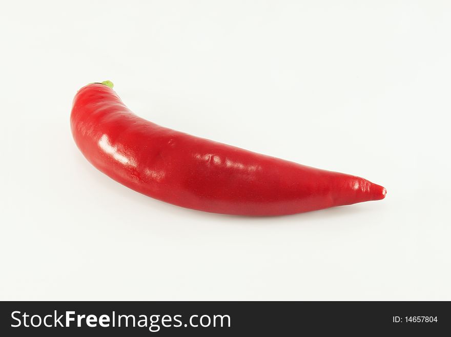 Hot red chili pepper on a white background, isolated