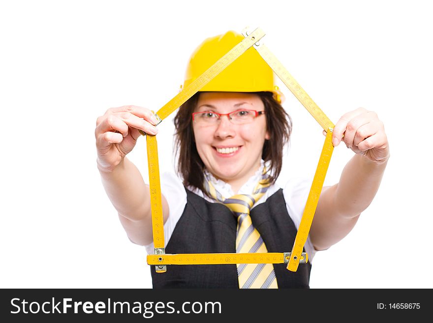 Female builder with yellow hardhat holds measure in the shape of hardhat, studio shoot isolated on white background. Female builder with yellow hardhat holds measure in the shape of hardhat, studio shoot isolated on white background