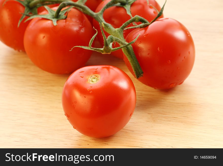 Ripe vine tomatoes on a wood background