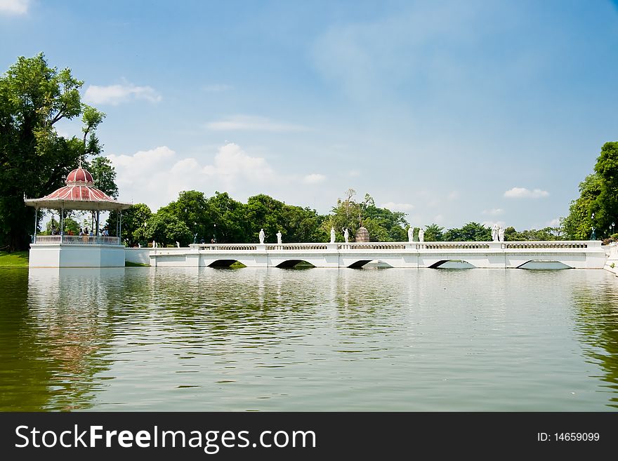 A white bridge cross over a pond, Ayutthaya Thailand. A white bridge cross over a pond, Ayutthaya Thailand.