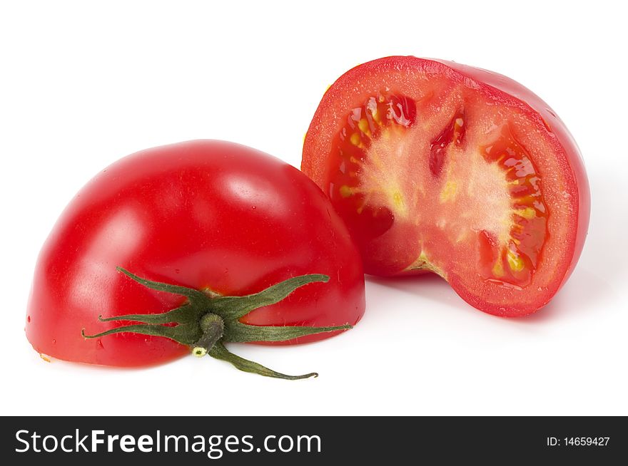 Two halves of tomato isolated over white background