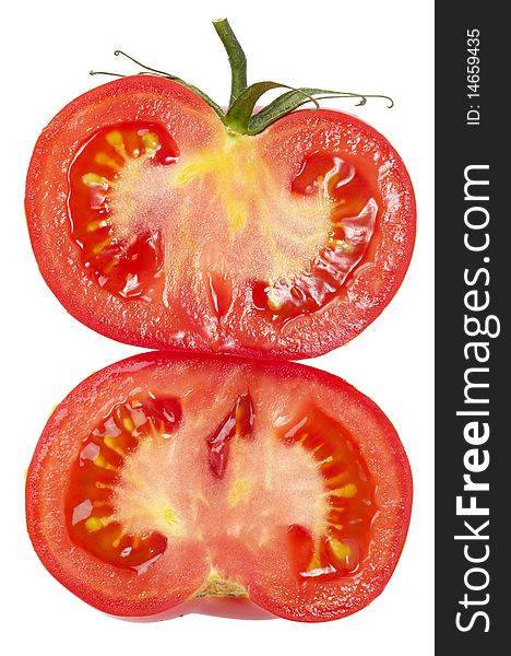 Two halves of tomato isolated over white background