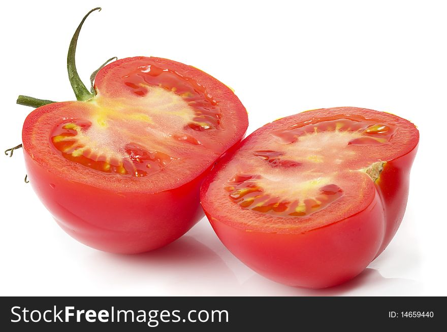 Two halves of tomato isolated over white background