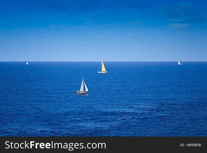 Sailboats on the Caribbean Sea with beautiful Blue Skies