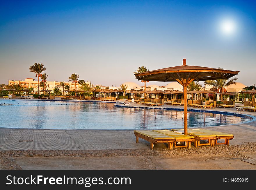 A hotel pool early morning in egyptian resort. A hotel pool early morning in egyptian resort..