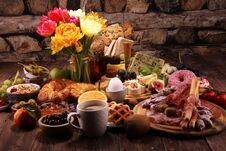 Breakfast On Table With Bread Buns, Croissants, Coffe And Eggs Royalty Free Stock Photo