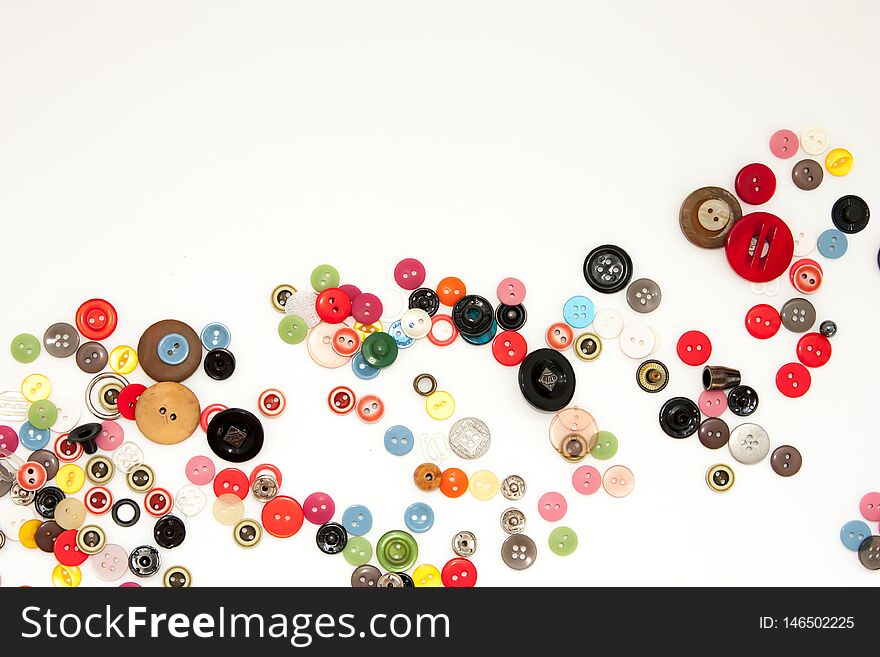 Flat lay with colorful sewing buttons, mock up, top view. Layout buttons mockup on blank white background for needlework, sewing