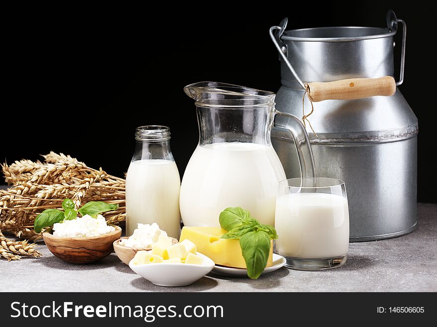 Milk products. tasty healthy dairy products on a table and milk jar, glass bottle and cheese. Milk products. tasty healthy dairy products on a table and milk jar, glass bottle and cheese