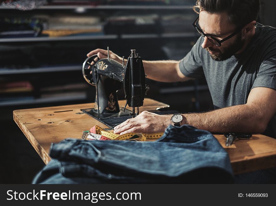 Fashion Designer Working In His Studio