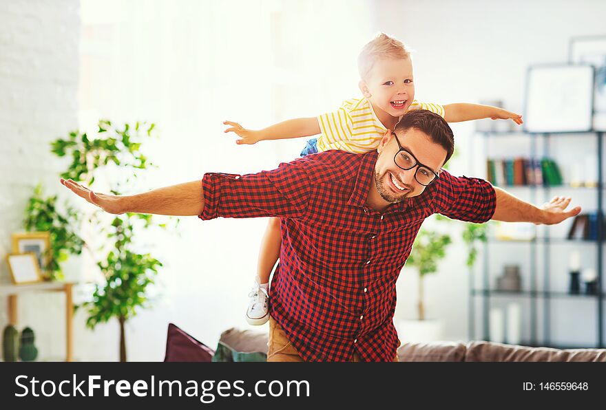 Father`s day. Happy family son hugs his dad