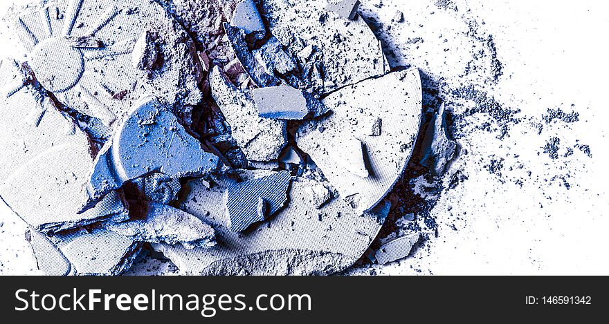 Crushed eyeshadows and powder isolated on white background