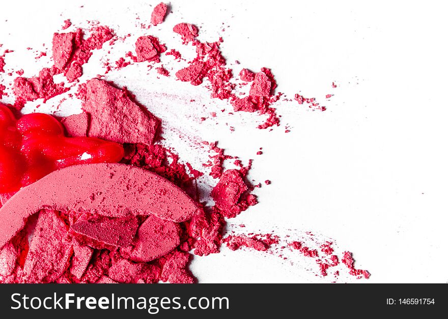 Beauty texture, cosmetic product and art of make-up concept - Crushed eyeshadows, lipstick and powder isolated on white background