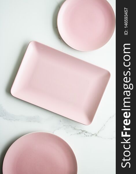 Pink empty plate on marble, flatlay - stylish tableware, table decor and food menu concept. Serve the perfect dish. Pink empty plate on marble, flatlay - stylish tableware, table decor and food menu concept. Serve the perfect dish