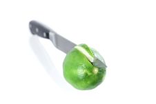 A Lime Section Cut By A Chefs Knife Royalty Free Stock Photo
