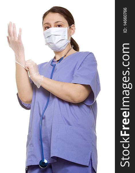 Doctor putting her gloves on before surgery