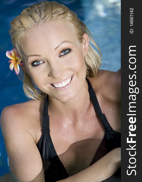 Portrait of young attractive woman having good time swimming pool. Portrait of young attractive woman having good time swimming pool