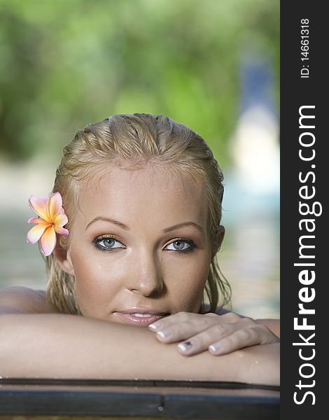 Portrait of young attractive woman having good time swimming pool. Portrait of young attractive woman having good time swimming pool