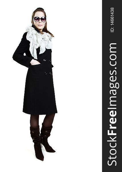 Fashionable girl in an autumn coat over white
