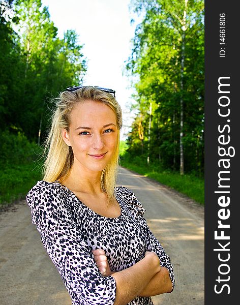 Beautiful young woman looking confident on nature background. Beautiful young woman looking confident on nature background