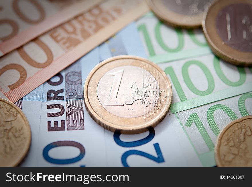 Euro Banknotes and coins closeup. narrow focus. Euro Banknotes and coins closeup. narrow focus.