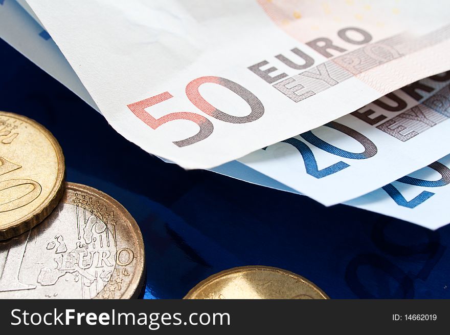 Euro Banknotes and coins closeup. selective focus. Euro Banknotes and coins closeup. selective focus.