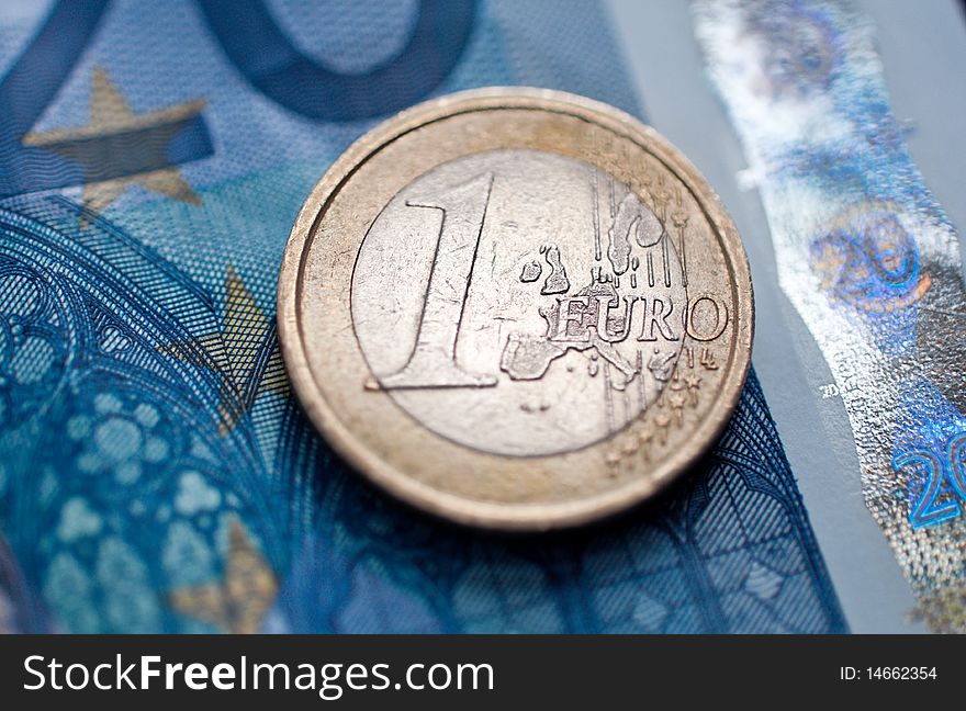 One euro coin and banknotes  closeup. selective focus.