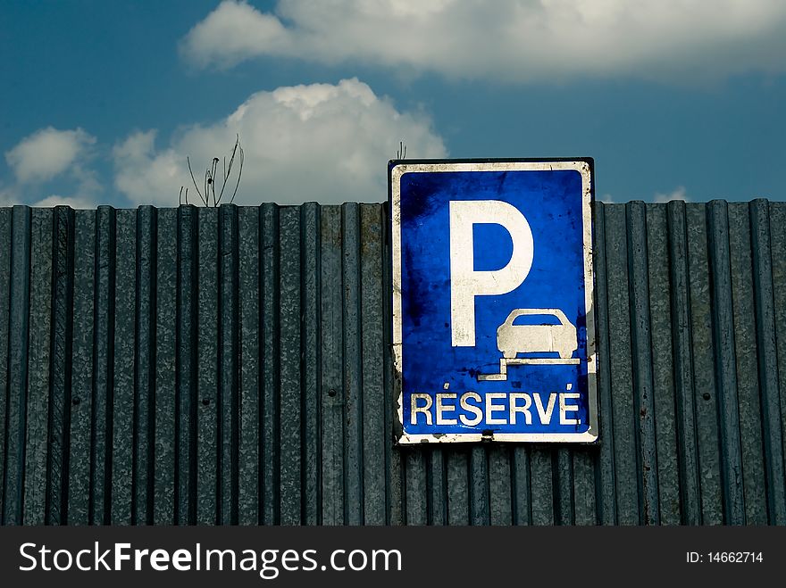 Parking sign and blue sky with white clouds. Parking sign and blue sky with white clouds