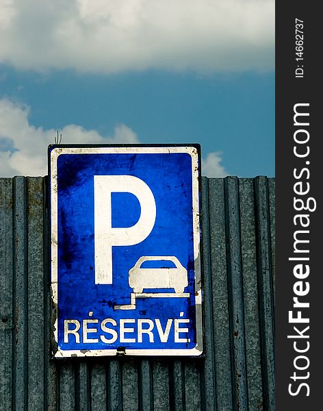 Parking sign and blue sky with white clouds. Parking sign and blue sky with white clouds