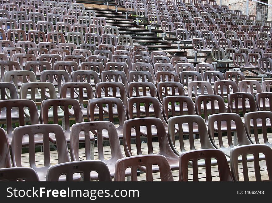 Chairs on the auditorium of an open-air theatre.