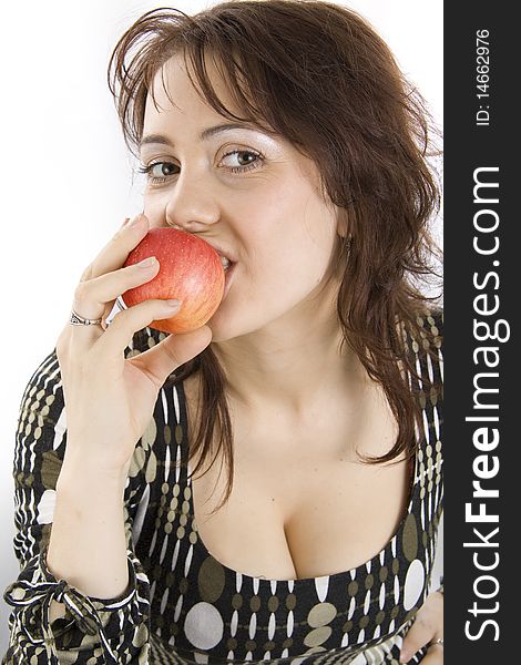 The beautiful young woman eats an apple