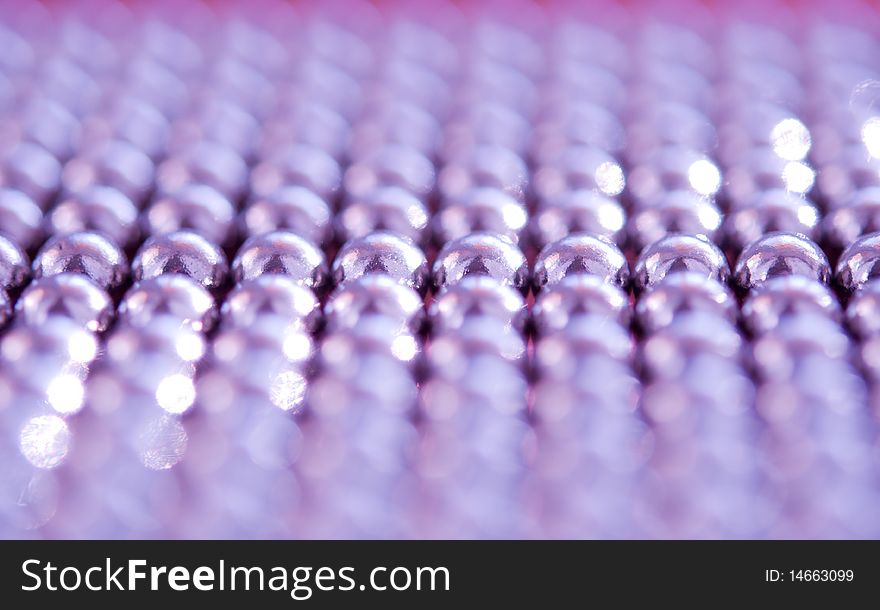 Shiny pink beads abstract background.  selective focus. Shiny pink beads abstract background.  selective focus.