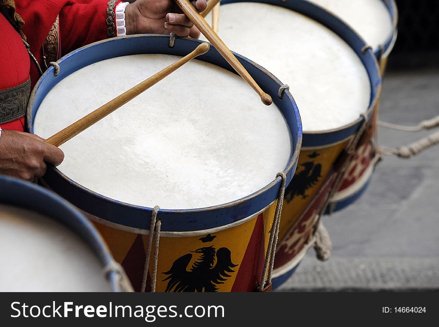 Drums played during a re-enactment. The people are in costumes.