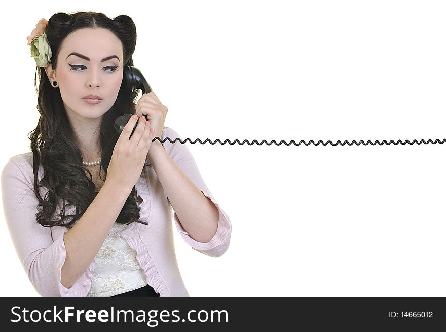 Beautiful young woman girl talking on old phone isolated on white in studio. Beautiful young woman girl talking on old phone isolated on white in studio