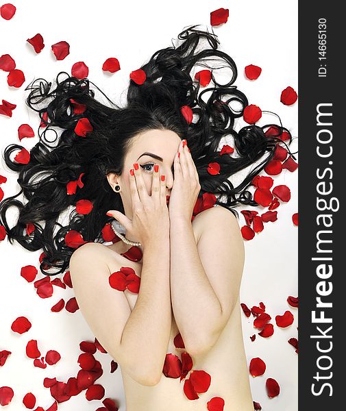 Woman with falling rose petals