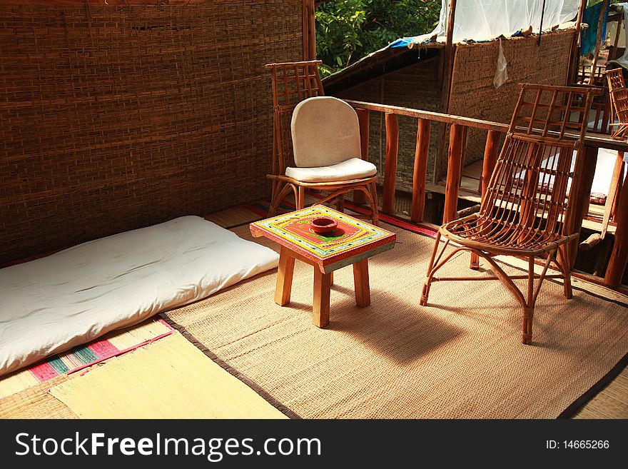 An outdoor patio on the roof of a charming straw hut. An outdoor patio on the roof of a charming straw hut.