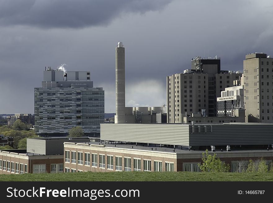 Exterior corporate medical office buildings with storm clouds during day. Exterior corporate medical office buildings with storm clouds during day